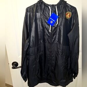A Columbia Atlanta United full zip hooded rain coat in a men's size large. NWT